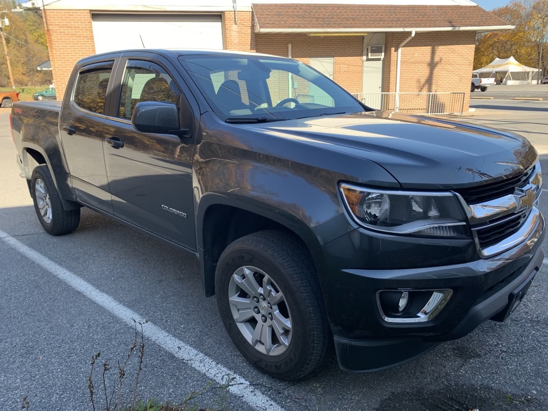 Bed Cover and Vent Visors Protect a 2015 Chevrolet Colorado