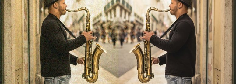 A man with a saxophone and his mirror image the other side